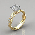 Two-tone ring in gold and silver with zirconia accent. By Sophi.