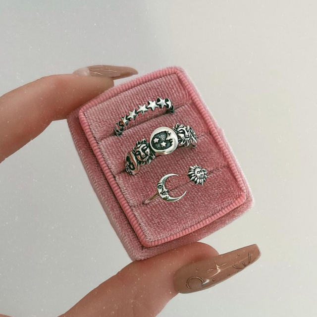 Set of vintage-style sterling silver rings featuring small moon and star shapes. By Sophi.
