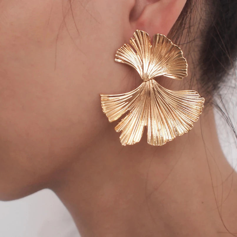 Ginkgo leaf earrings in gold tone. By Sophi.