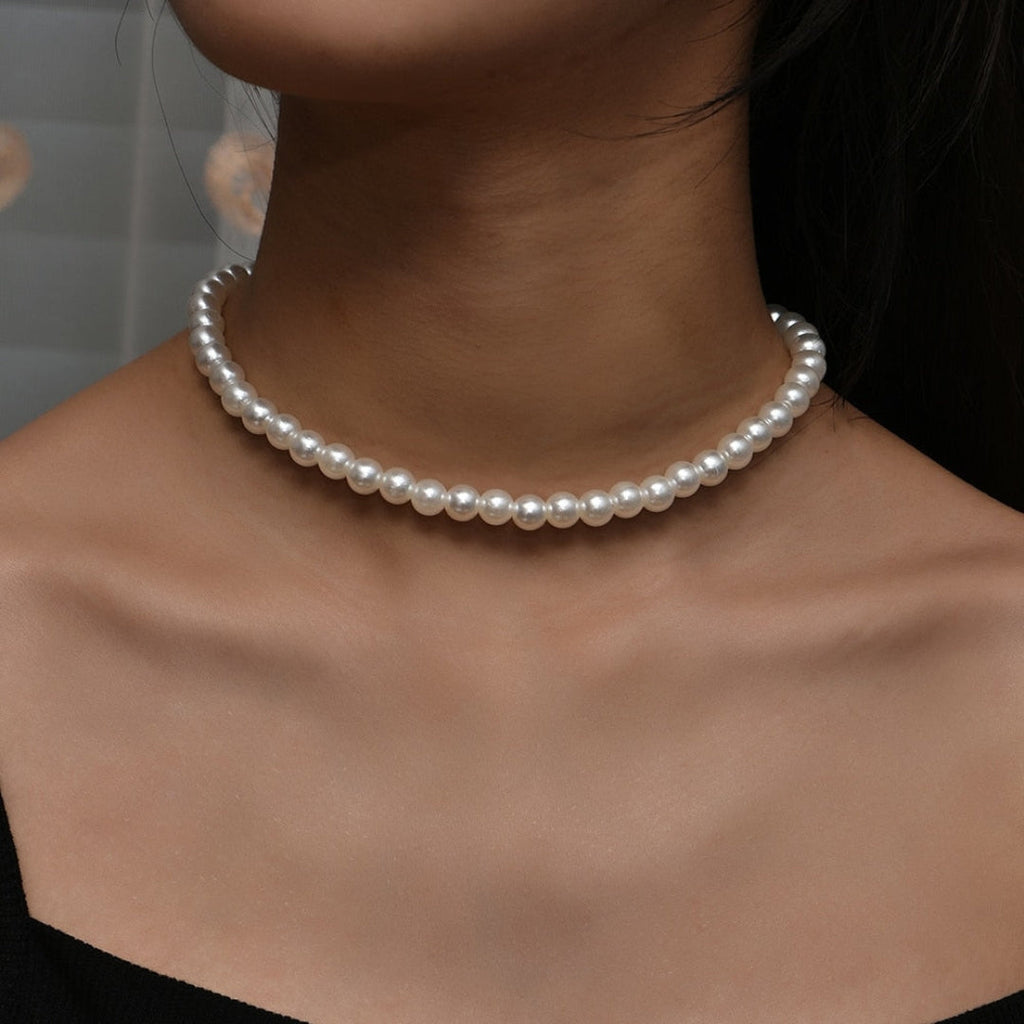 Classic strand of small white pearls on fine clasp. By Sophi.