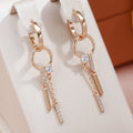 Elegant Dangling Earrings with Zirconia in Gold