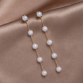 Dangling Freshwater Pearl Earrings in Gold