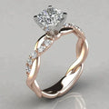 Braided gold ring with small cubic zirconia accents along the rope. By Sophi.