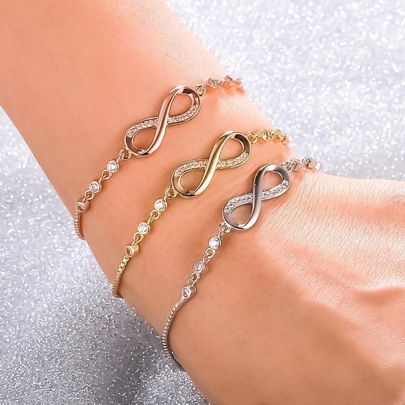 Adjustable silver infinity chain bracelet on wrist. By Sophi.