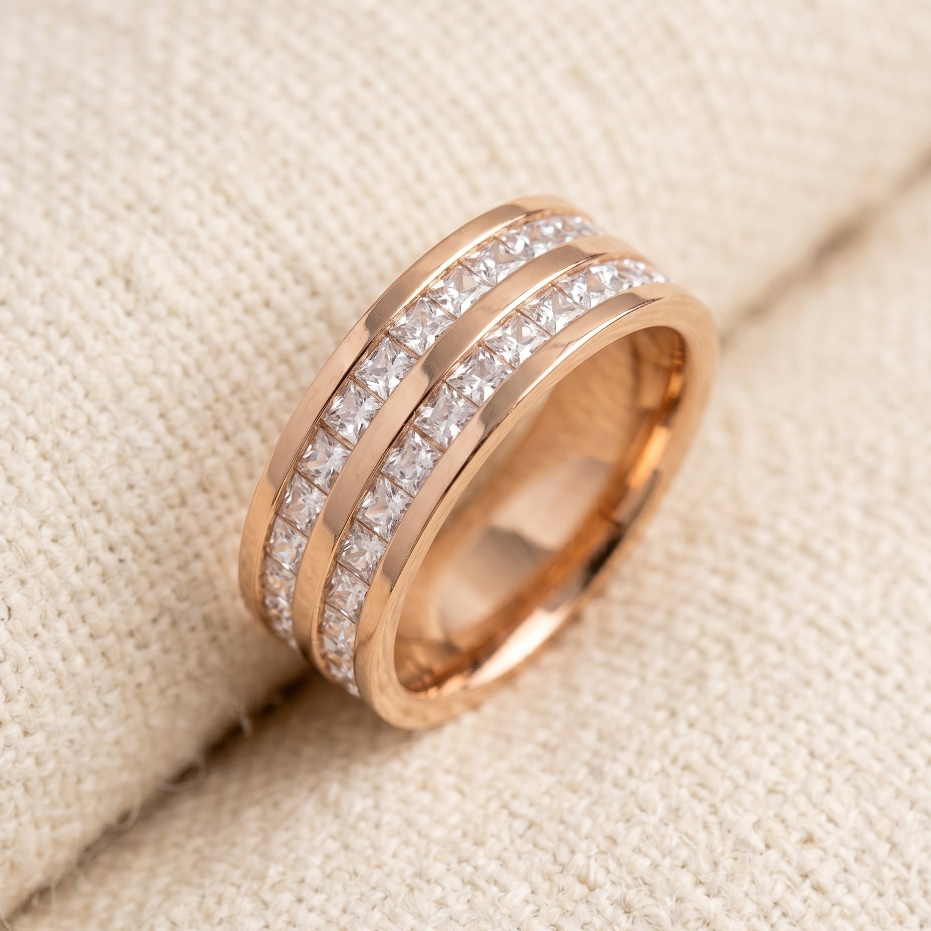 By Sophi Elegant Inlaid Zirconia Ring flat-lay on warm cream