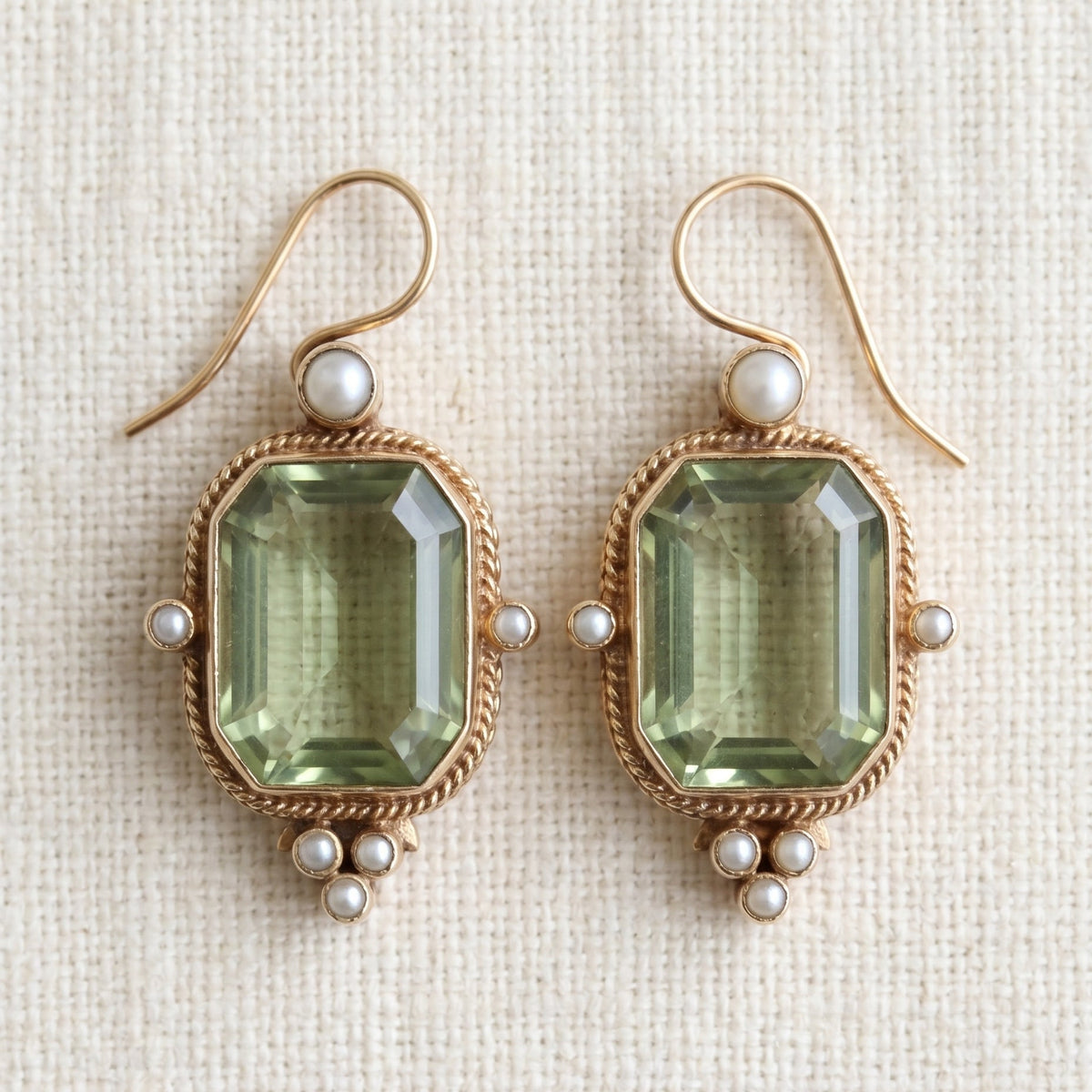 By Sophi Vintage Green and Pearl Earrings flat-lay on warm cream