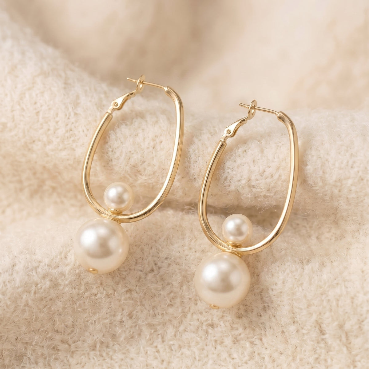 By Sophi Vintage Charming Pearl Earrings flat-lay on warm cream