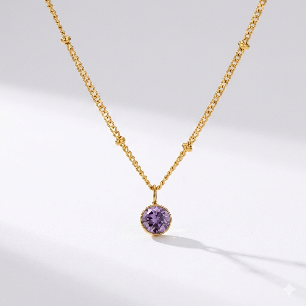 Amethyst birthstone pendant necklace in gold-toned chain. By Sophi.
