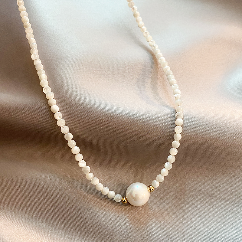 Pearl birthstone necklace, white pearl strand with center pearl. By Sophi.