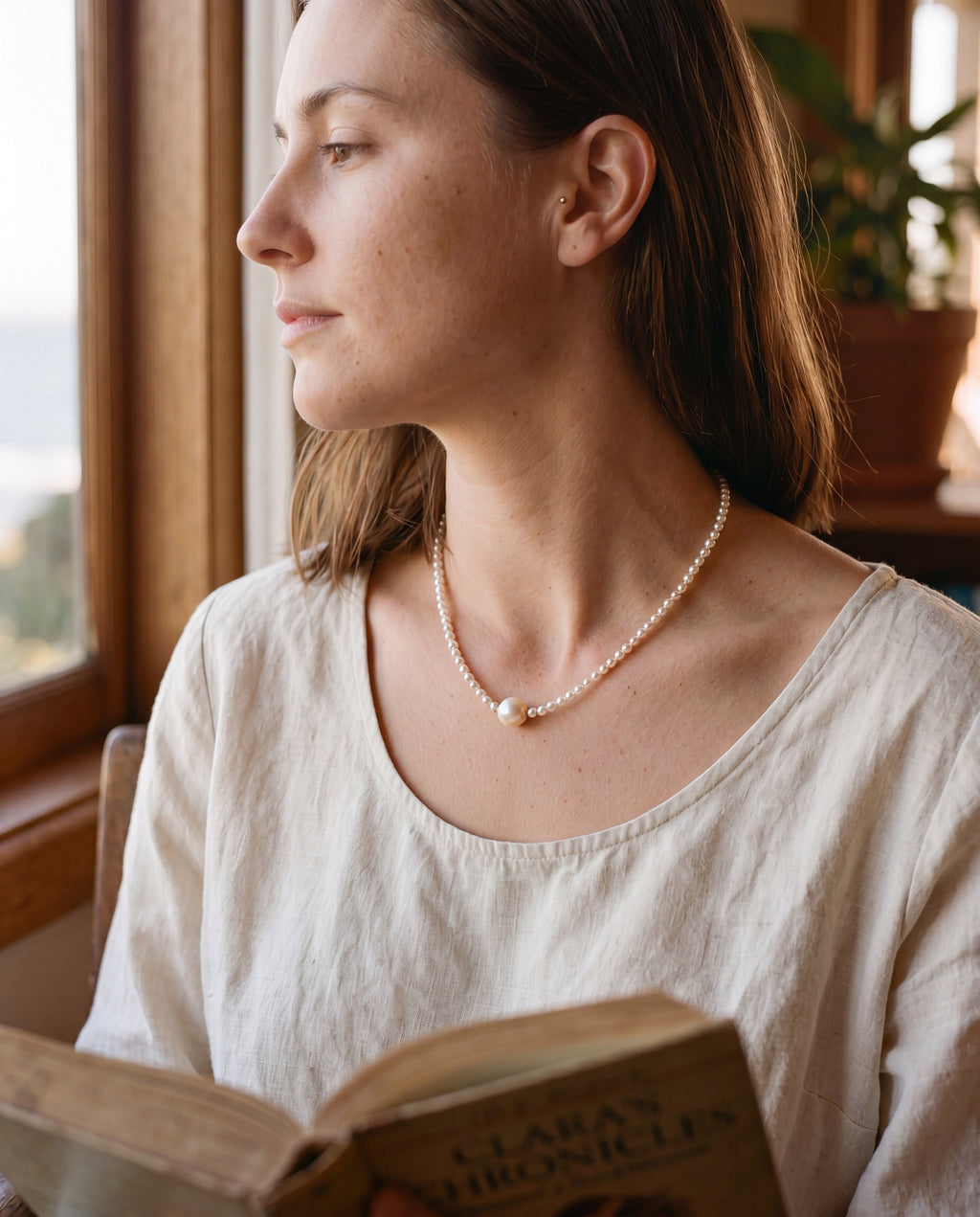 Pearl Birthstone Necklace, styled with cream linen, worn quietly