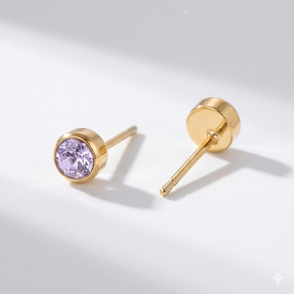 Amethyst birthstone stud earrings in gold-toned bezel. By Sophi.