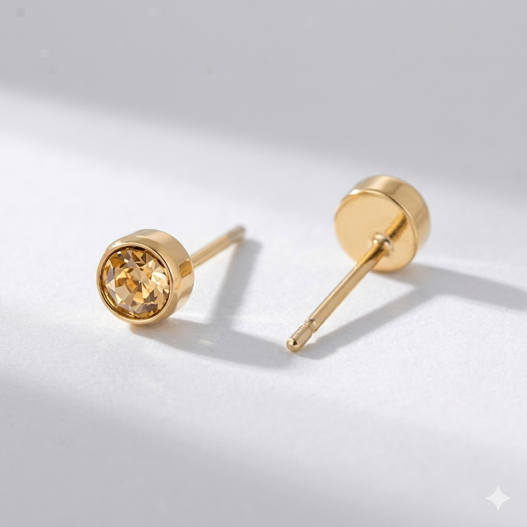 Citrine birthstone stud earrings in gold-toned bezel. By Sophi.