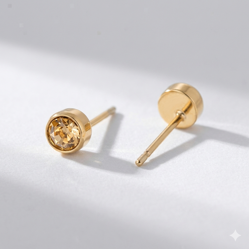 Citrine birthstone stud earrings in gold-toned bezel. By Sophi.