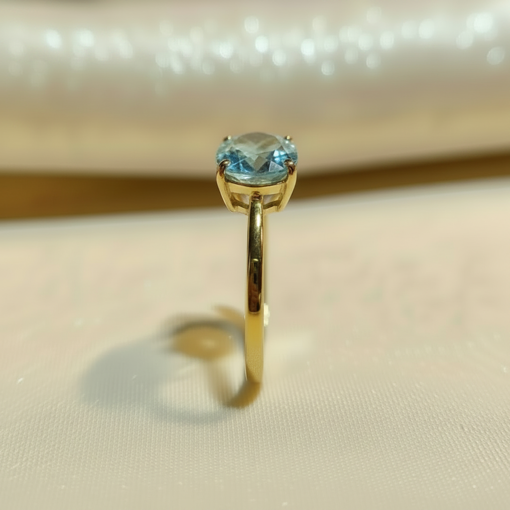 Natural Blue Topaz Solitaire Ring in Gold