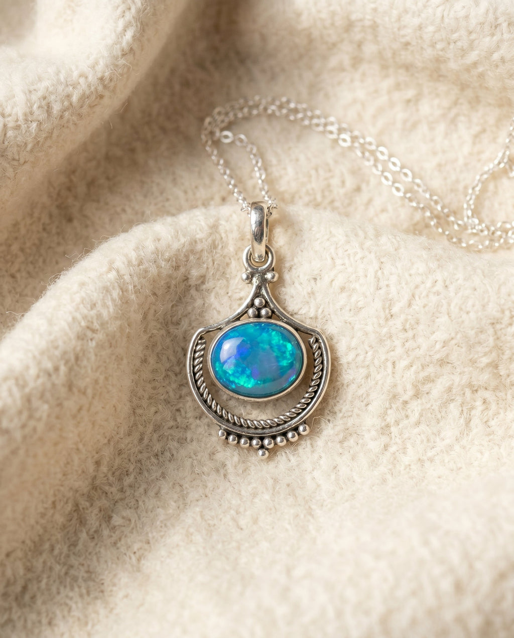 By Sophi Boho Opal Necklace in Silver flat-lay on warm cream