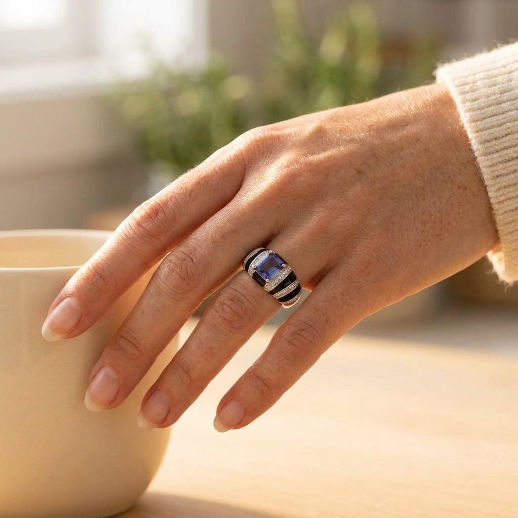 By Sophi Natural Iolite and Black Enamel Ring worn on ring finger, warm morning kitchen light