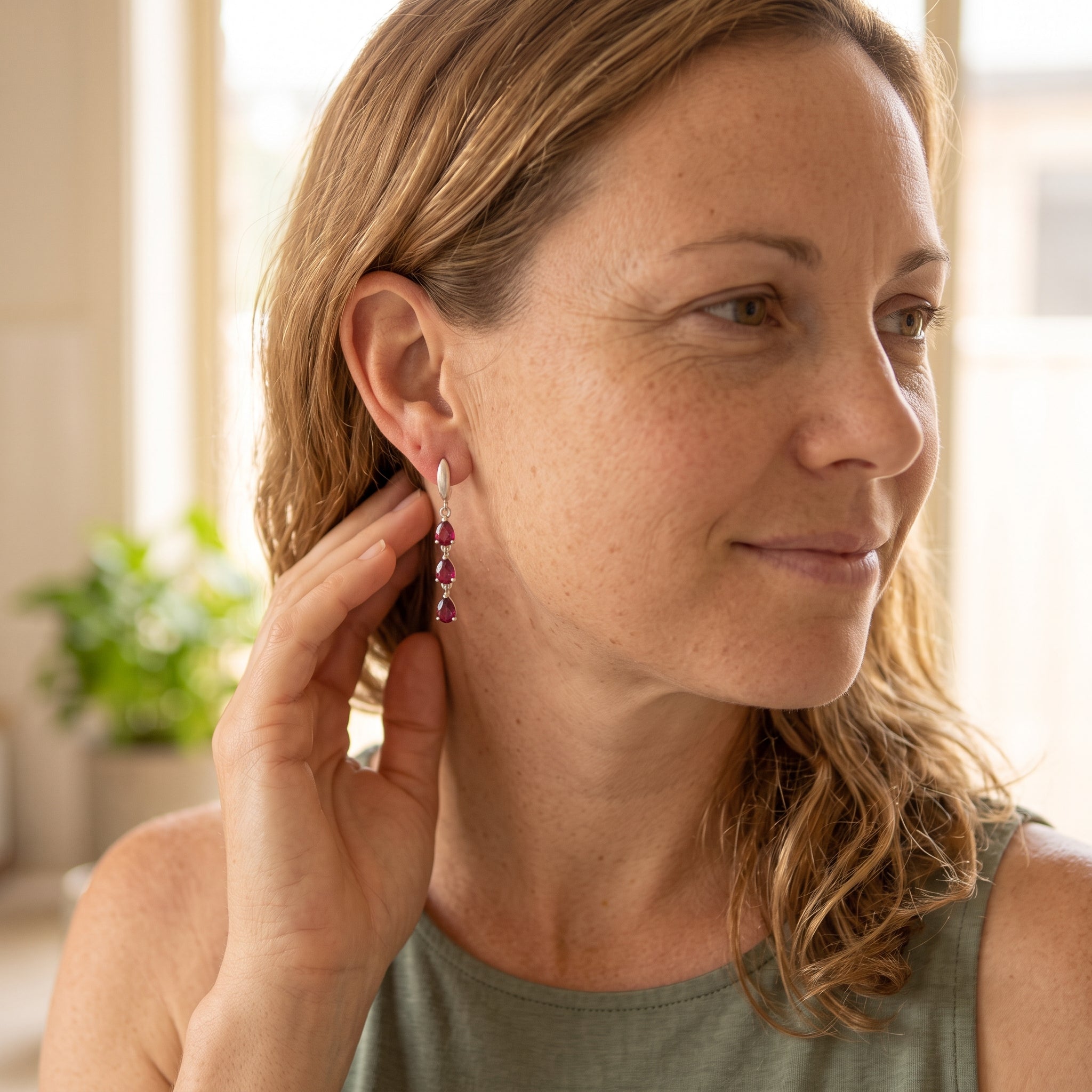 By Sophi Natural Rhodolite Garnet Drop Earrings on model, warm morning light