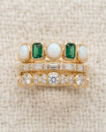 By Sophi Vintage White and Green Opal Rings stack flat-lay on warm cream