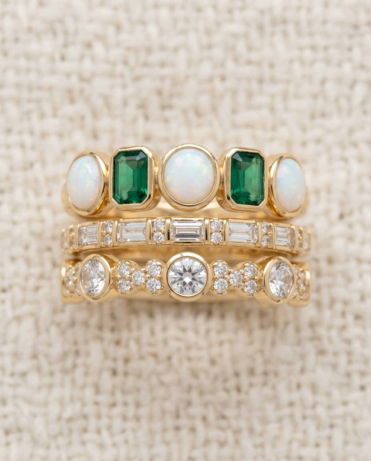 By Sophi Vintage White and Green Opal Rings stack flat-lay on warm cream