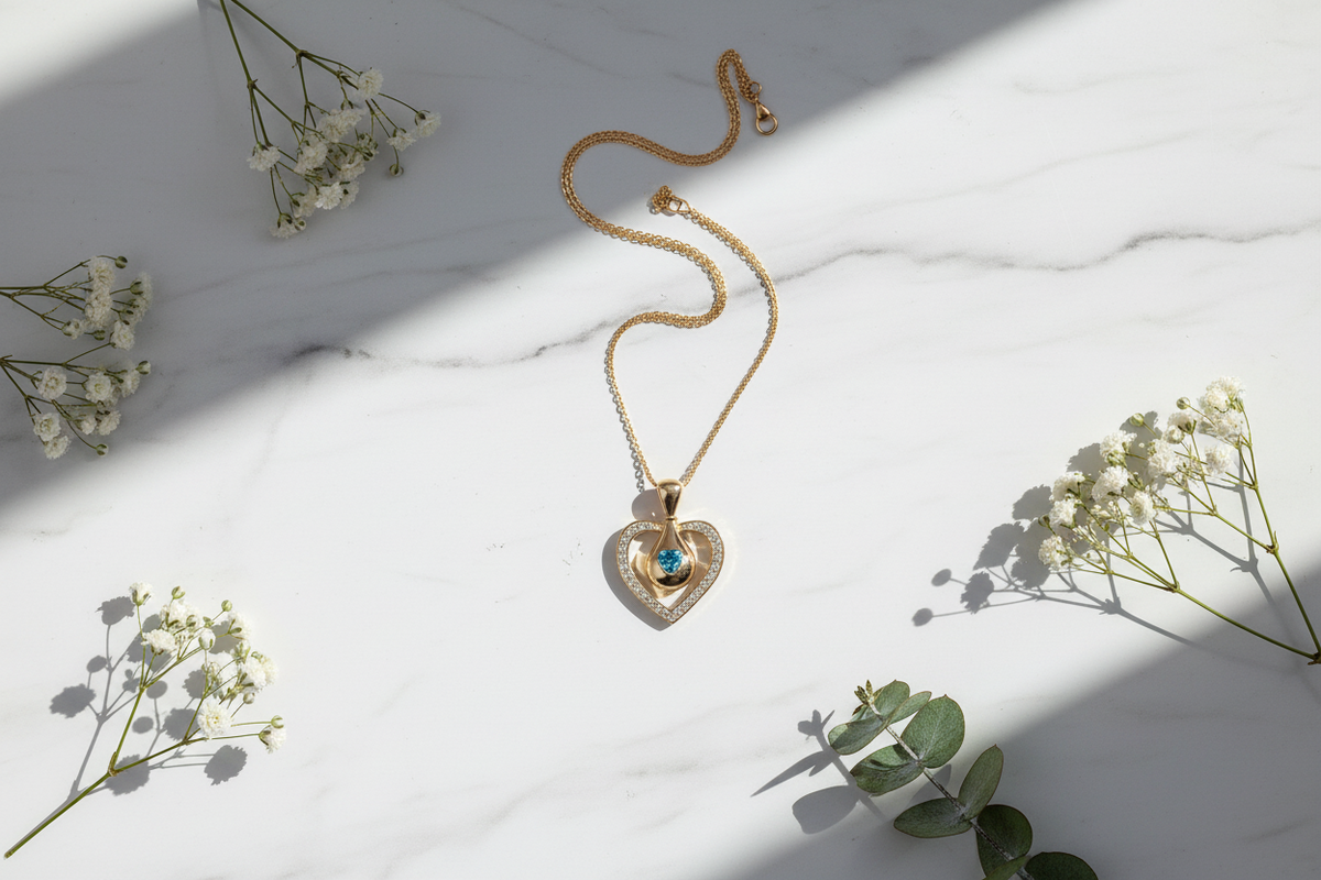 Blue Crystal Heart Pendant in Gold