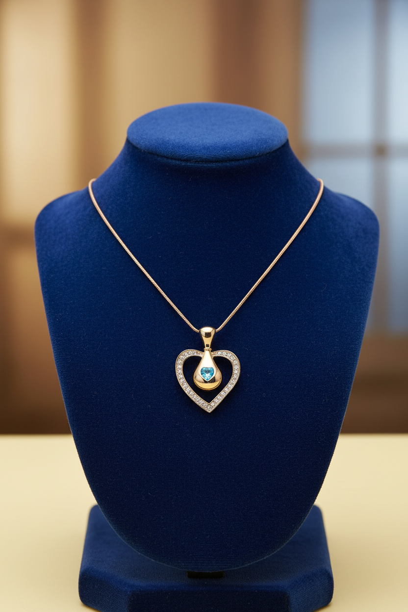 Blue Crystal Heart Pendant in Gold