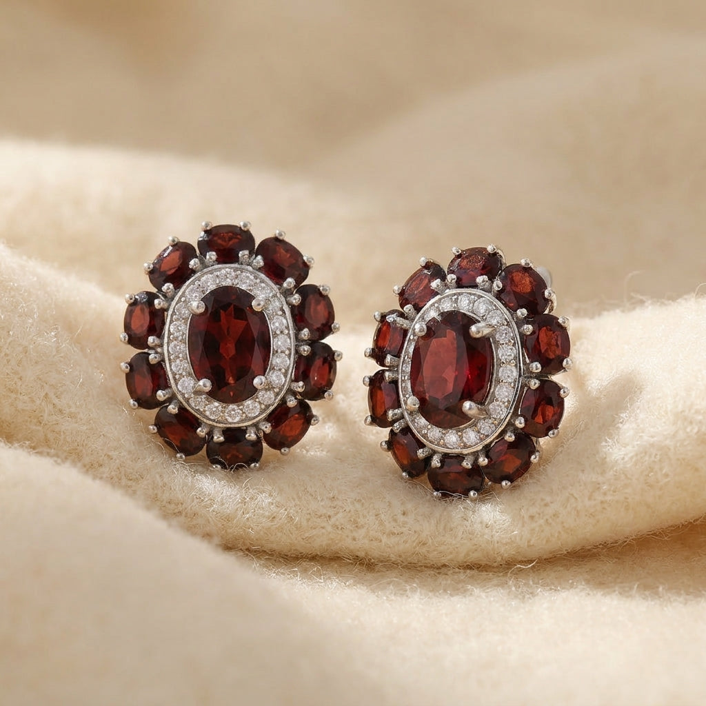 By Sophi Natural Garnet Cluster Earrings, catalog flat-lay on warm cream wool