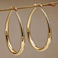 Vintage small gold hoop earrings. By Sophi.