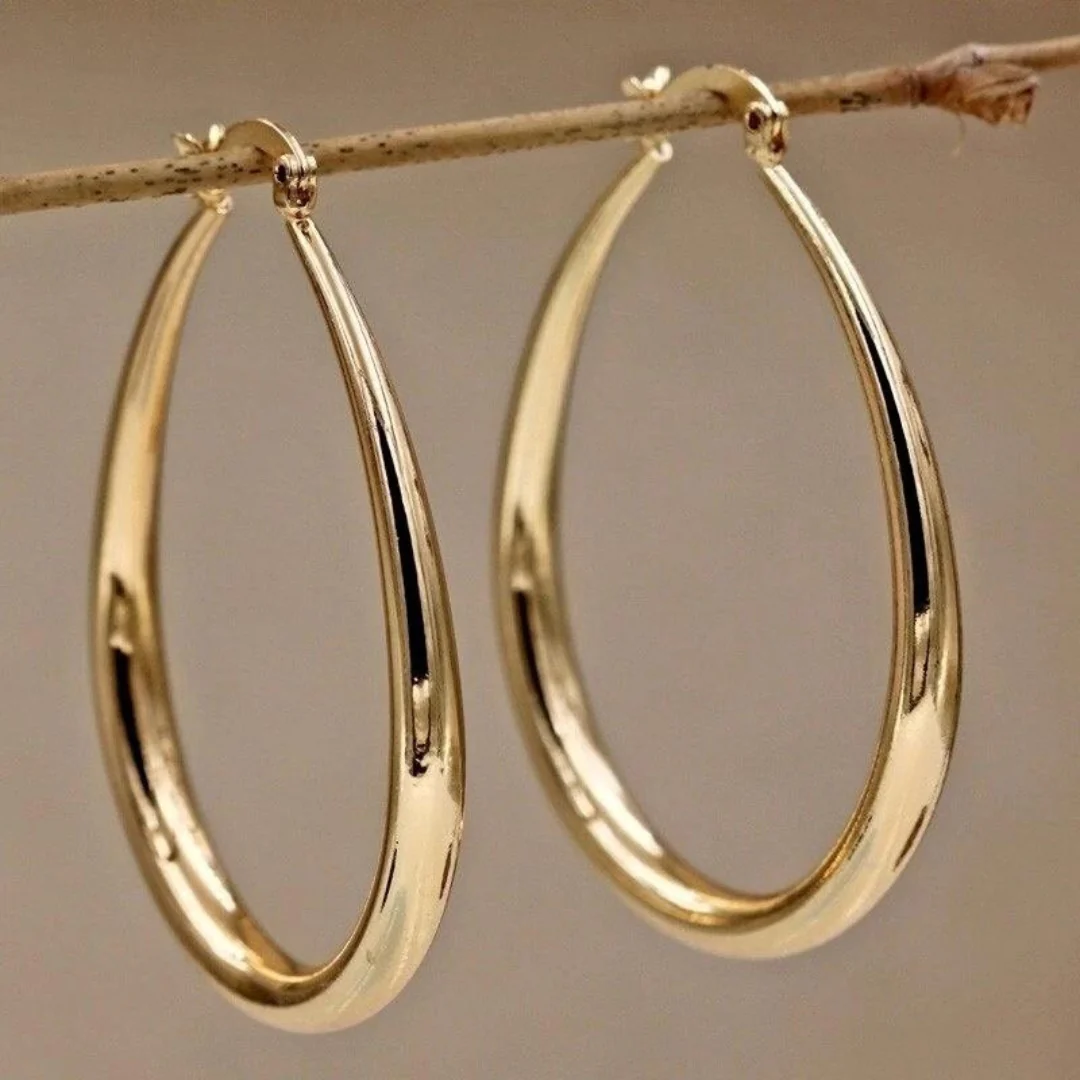 Vintage small gold hoop earrings. By Sophi.