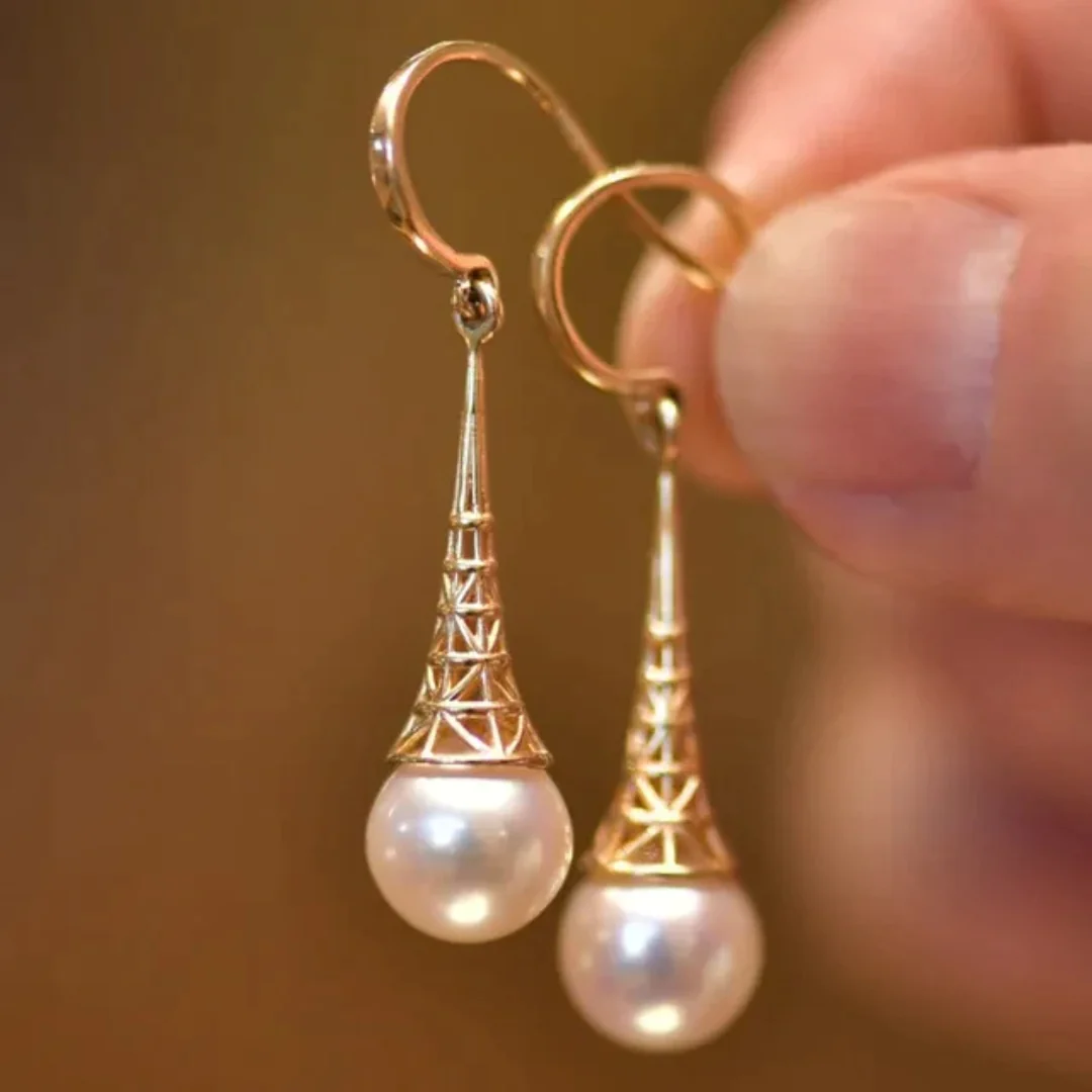 Vintage gold and pearl drop earrings, small pearl below short chain. By Sophi.