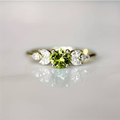 Vintage zirconia ring with olive-shaped bezel in gold tone. By Sophi.