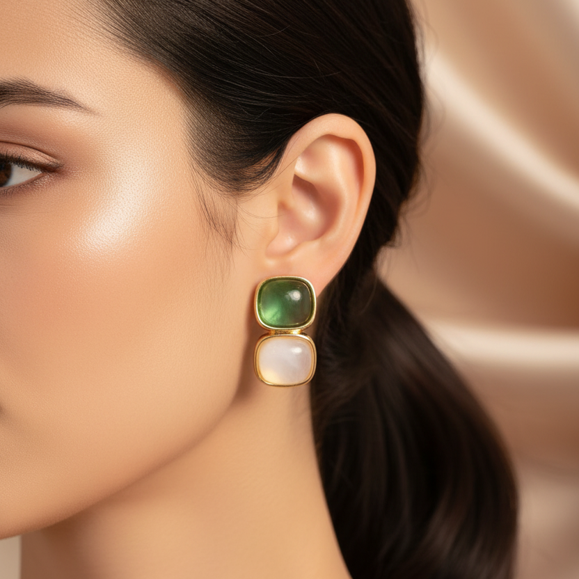 Woman wearing Elegant Earrings with White and Green Stones in Gold