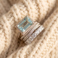 By Sophi Vintage Silver Blue Crystal Ring Set, flat-lay on warm cream wool