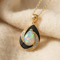 By Sophi Natural Ethiopian Opal Pendant Necklace, catalog flat-lay on warm cream wool