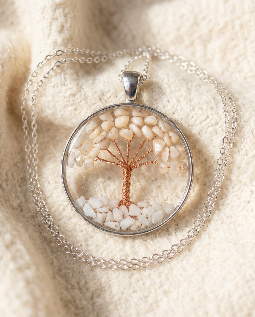 By Sophi Opal Tree of Life Necklace flat-lay on warm cream