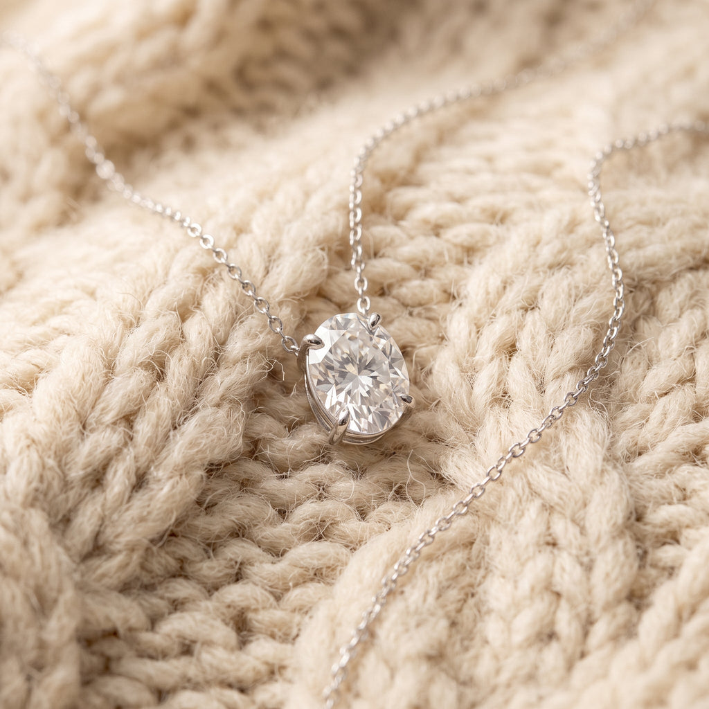 Oval moissanite pendant on warm cream chunky-knit wool, By Sophi