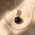 By Sophi Colorful Black Opal Necklace, Black Opal 1 red-flash variant on warm cream wool