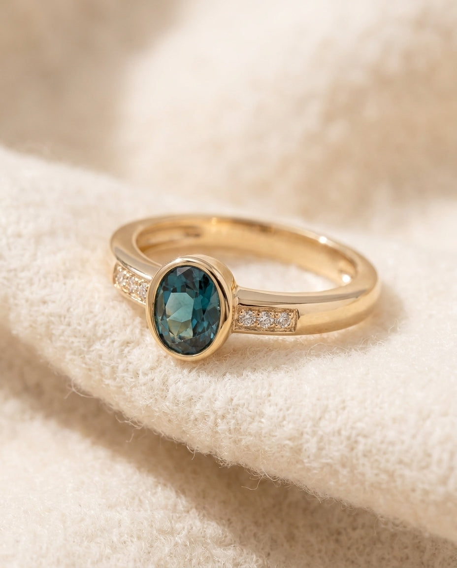 By Sophi Vintage Blue Inlaid Crystal Gold Ring flat-lay on warm cream wool