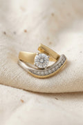 Vintage irregular gold and silver zirconia ring detail macro on neutral background