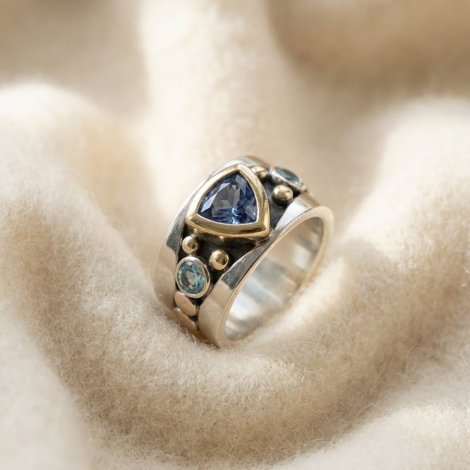 By Sophi Vintage Blue Crystal Ring flat-lay on warm cream wool