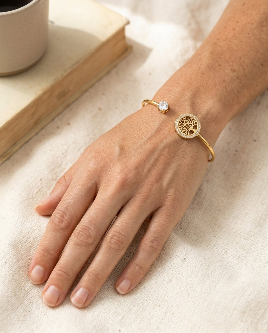 Tree of Life Adjustable Bracelet on a real woman's wrist, cream linen, soft natural light