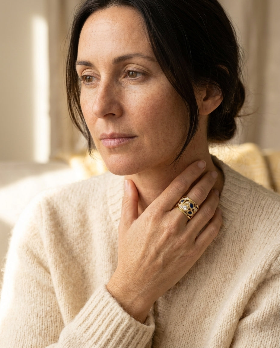 By Sophi Vintage Blue Zirconia Ring in Gold, editorial portrait worn with warm cream cardigan