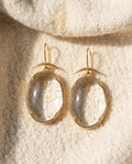 By Sophi Vintage Rock-Crystal Cabochon Drops in Gold flat-lay on warm cream wool